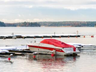 boat docked with cold weather cover on it