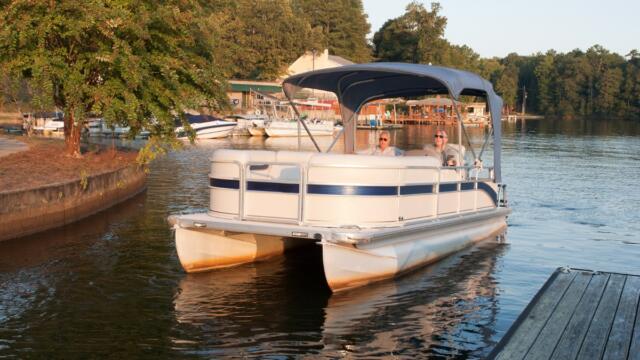 pontoon boat at sunset what boat type is best for you