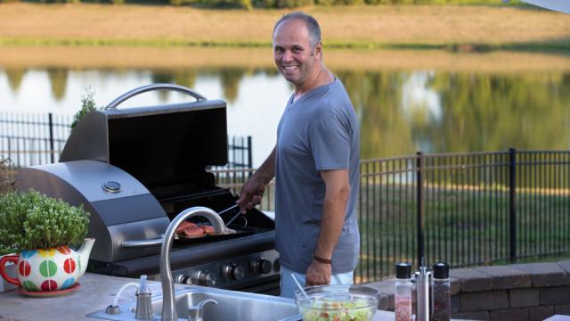 grilling burgers by the lake