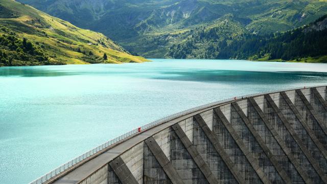 aerial view of dam and the water it is holding back