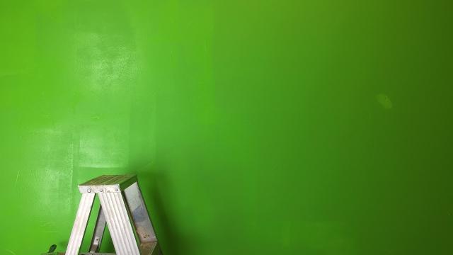 green wall with ladder