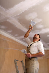 man working on drywall man working on drywall