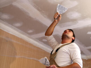 man working on drywall