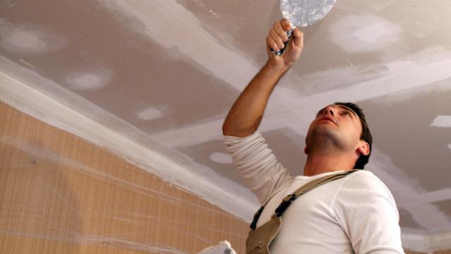 man working on drywall