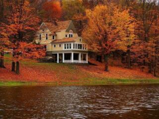 Lake home on the water during autumn