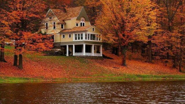 Lake home on the water during autumn
