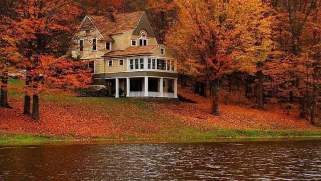 Lake home on the water during autumn