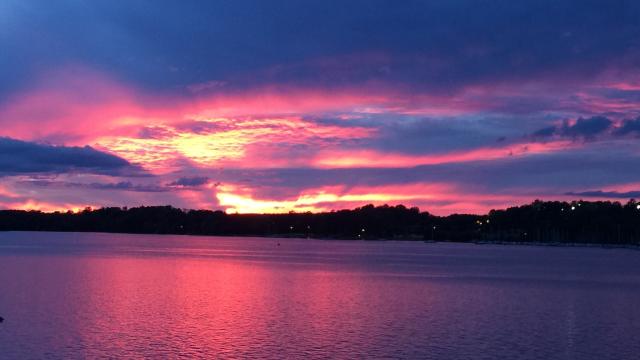 purple. yellow and pink sunset over open water