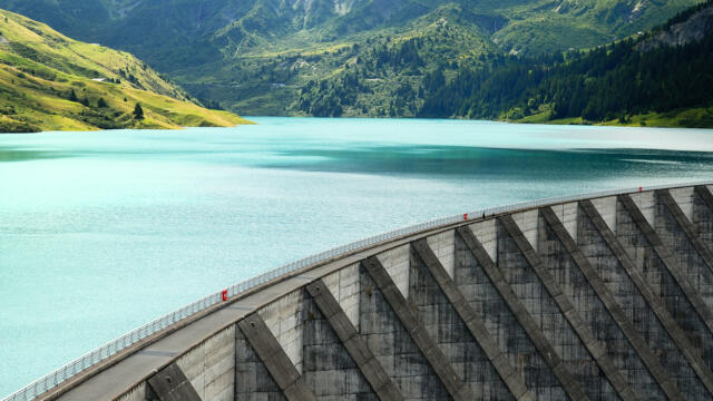 dam stopping turquoise water