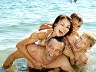 family of four in the water