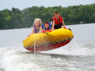 Kids tubing at the lake