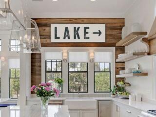 white and wood kitchen with lake sign