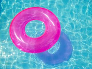 pink swimming pool ring float