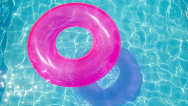 pink swimming pool ring float