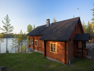 brown house overlooking lake