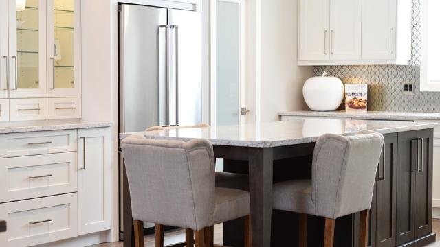 kitchen with white walls, stainless appliances