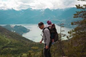 dad hiking with baby on his back