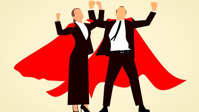 real estate agents, man and woman, in red capes