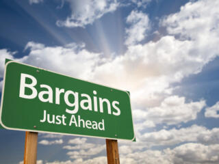 when to buy a lake home, bargains street sign