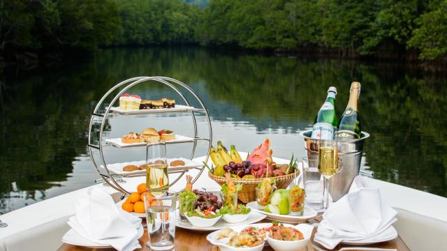 food on the bow of boat overlooking the lake