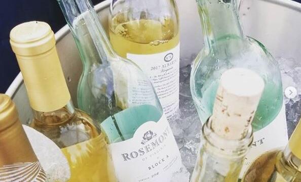A bucket of white wine bottles from the Rosemont of Virginia Winery