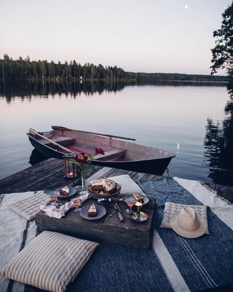Lake dining on blankets during sunset