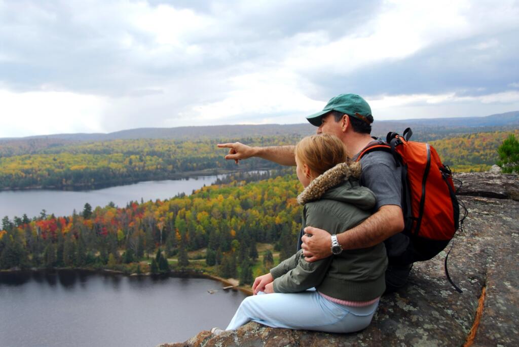Father pointing to Moosehead Lake with daughter