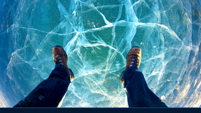 Person standing on frozen lake winter shoes looking down