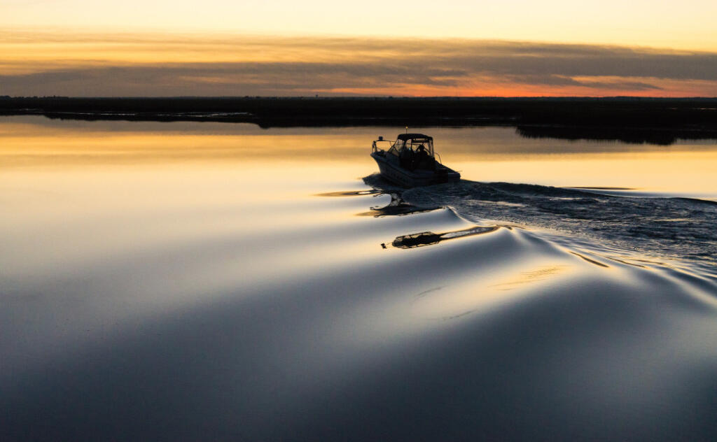 person boating on still waters