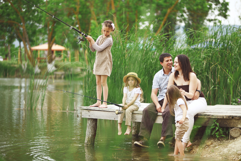 Family fishing on lake living on the water