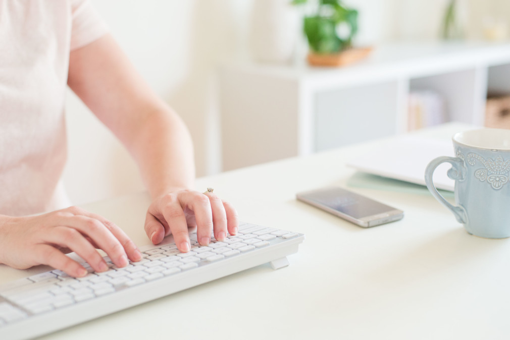 Person typing on keyboard looking for Business Ideas for Waterfront Home-Based Businesses