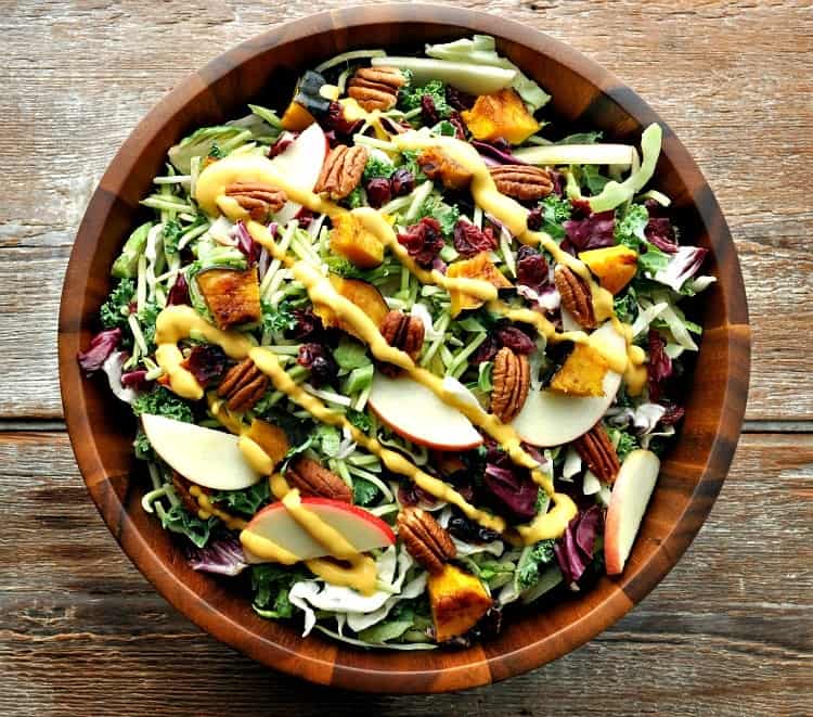 Fall salad with raisins, pecans, apples, cabbage, broccoli, and butternut squash. 
