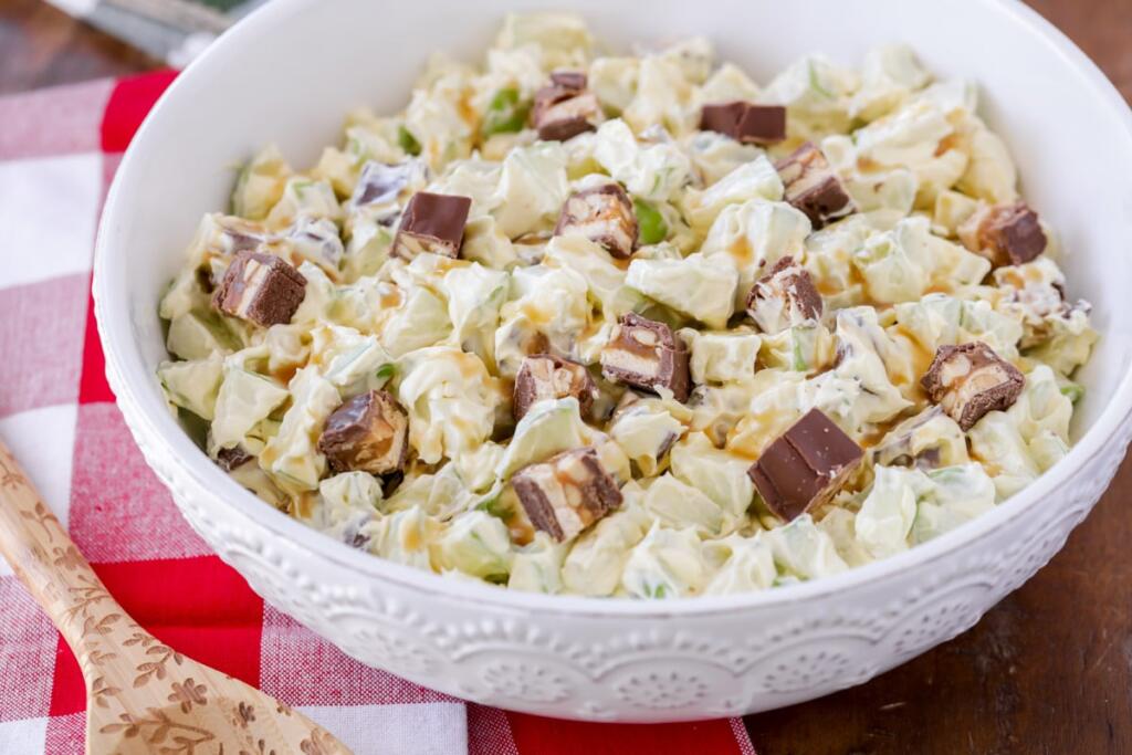 A dessert mix of snickers, cool whip, pudding, and Granny Smith apples.
