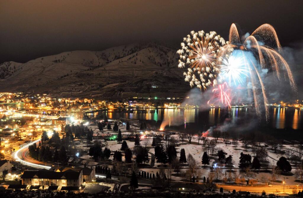 Winterfest at Lake Chelan, featuring a cozy snowy town and fireworks over the lake. 