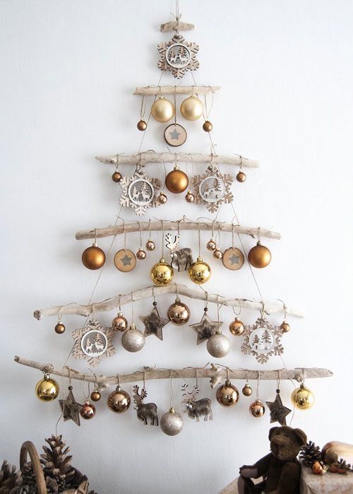 DIY hanging Christmas tree, made from repurposed wood and rustic ornaments.  
