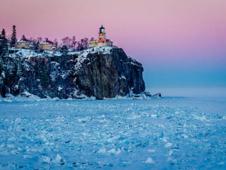Split Rock Lighthouse in Minnesota by the frozen Lake Superior.