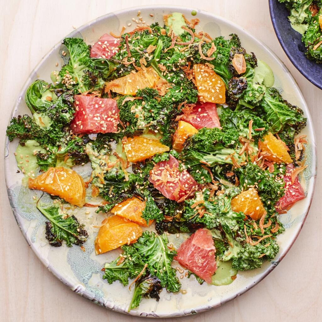 Charred Kale with Citrus and Green Tahini salad made with wilted curly kale, oranges, grapefruits, and a tahini dressing.