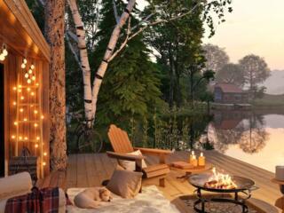 Adirondack chairs by a cozy firepit at the lake.