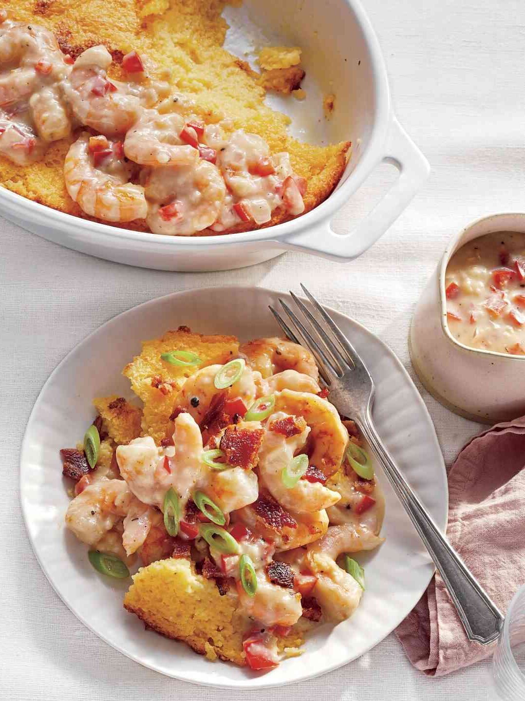 Shrimp and Grits Casserole with Shrimp Gravy made with cream, onions, and bell peppers all seasoned with thyme, black pepper, and cayenne.