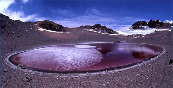 Red pool of water on Aguas Calientes. 