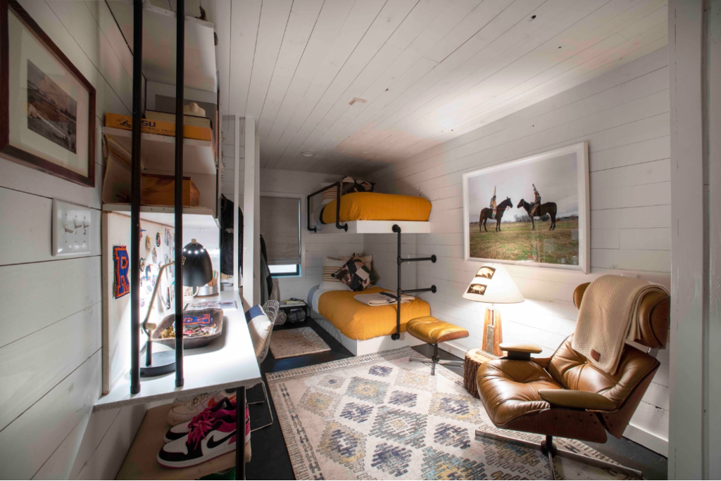 downstairs bunk room with bright orange bedding