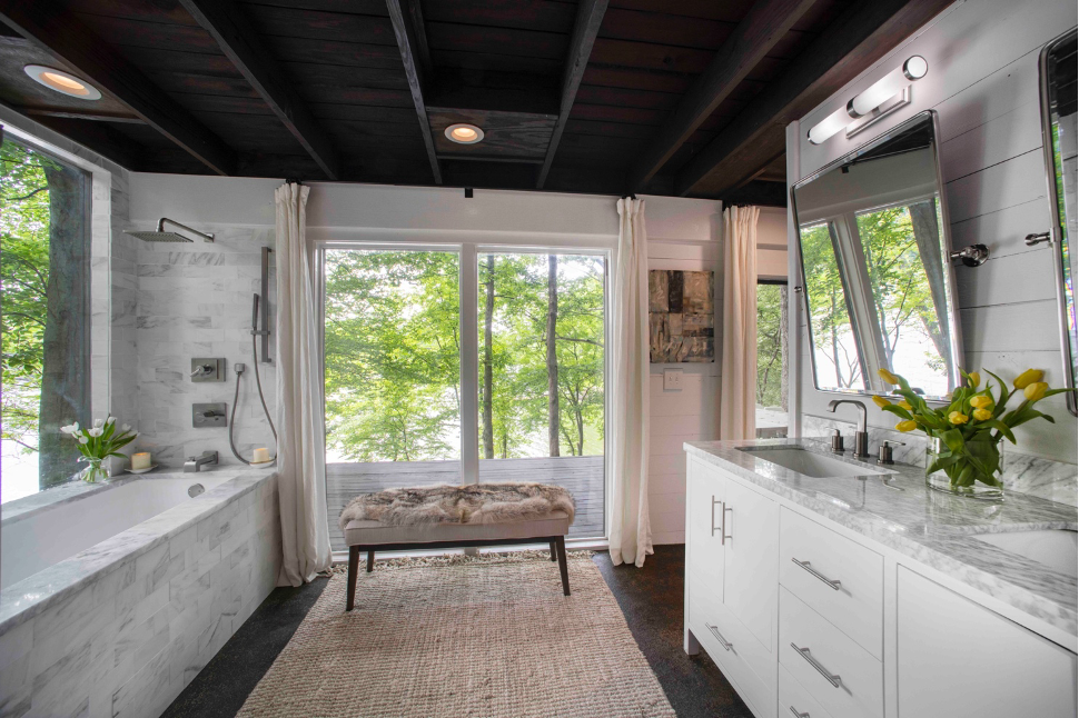 Owners' luxurious spa-like bathroom with soaking tub  and Alabama marble accents