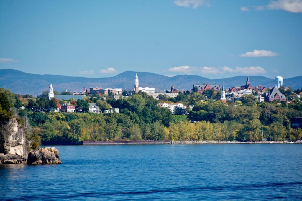 town and trees beside Lake Champlain