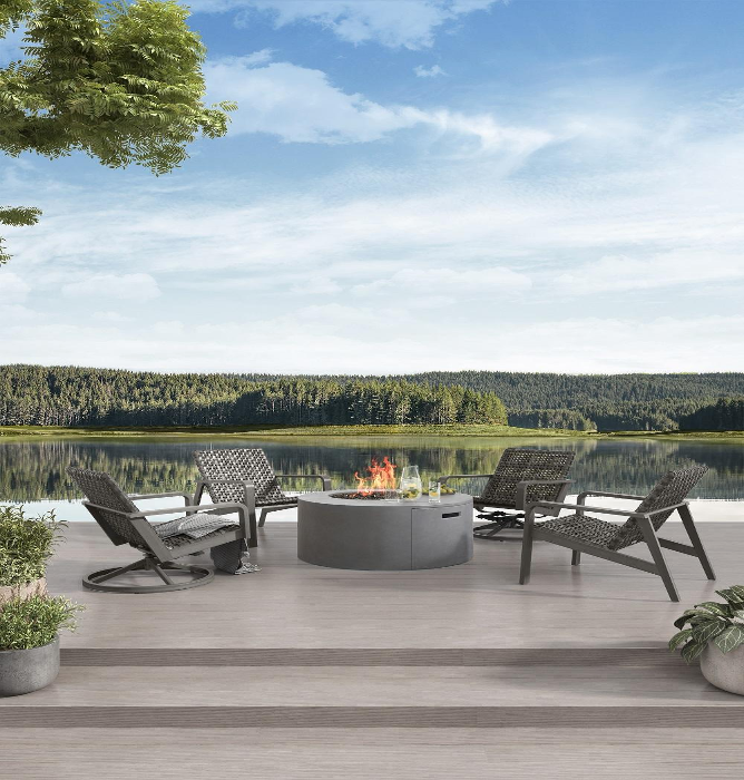 Outdoor fire pit, chairs on wooden platform deck in front of lake