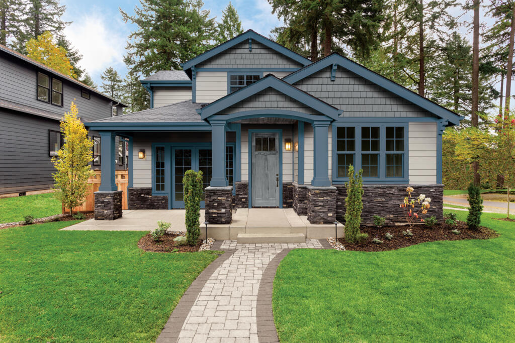 home with dark blue accents, asphalt shingles, and and siding