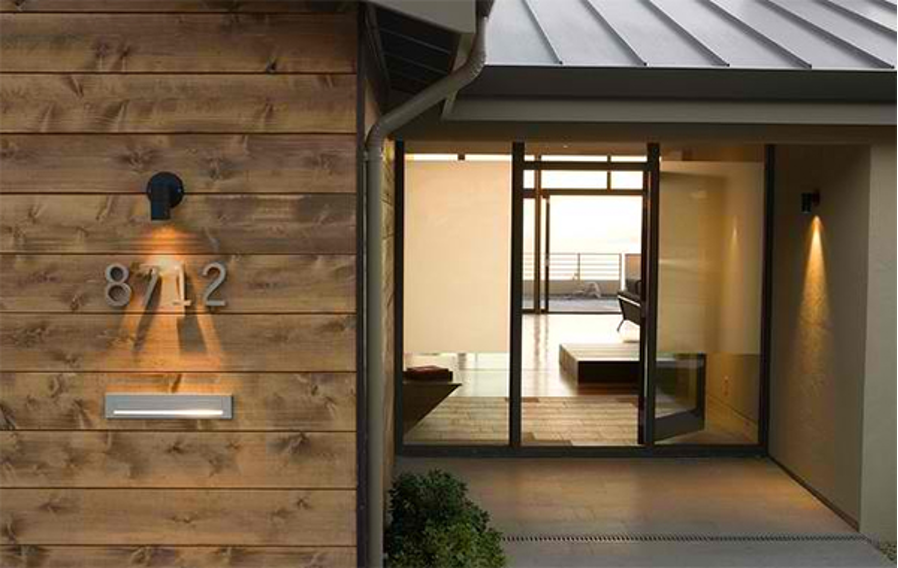 illuminated house numbers at front entrance of home