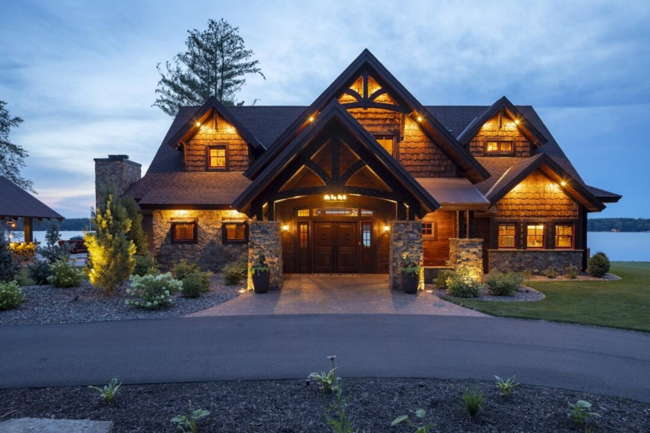 Exterior lighting for lake home at front entrance, lawn, under eaves, and rooflines