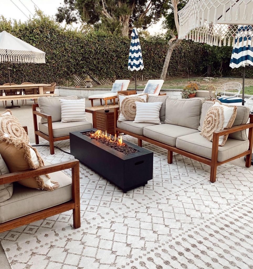 Outdoor rug and patio seating group with fire pit