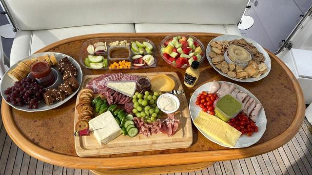 food on table on boat in the water