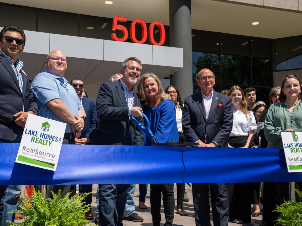 CEO, COO, and Mayor of Hoover cutting the blue ribbon